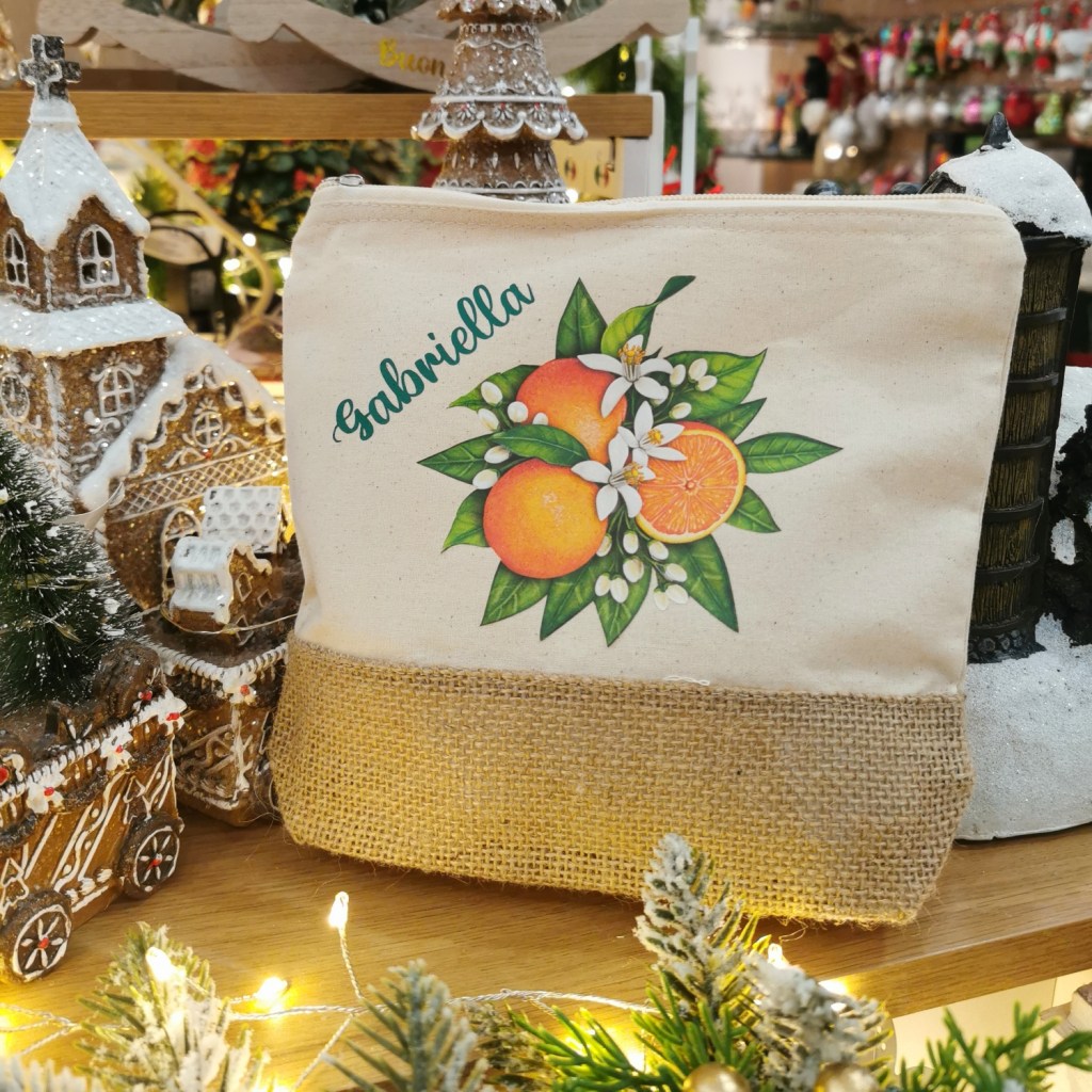 pochette in tessuto con arancio e fiori e nome personalizzato